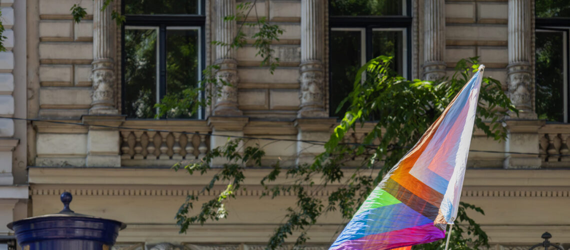 rainbow pride flag on a city street