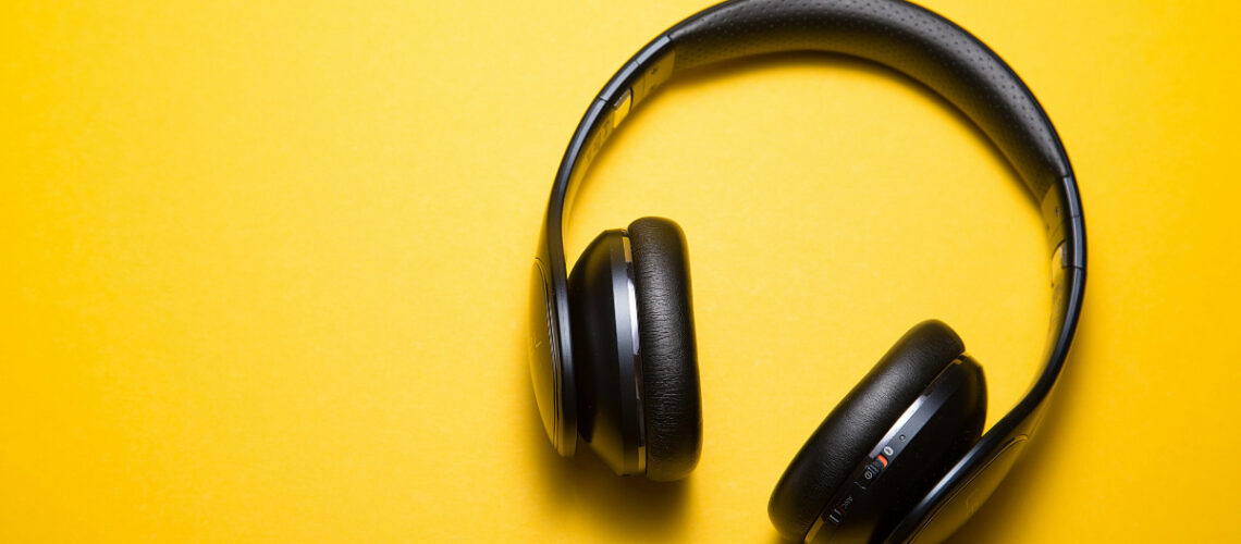 music headphones on a yellow table