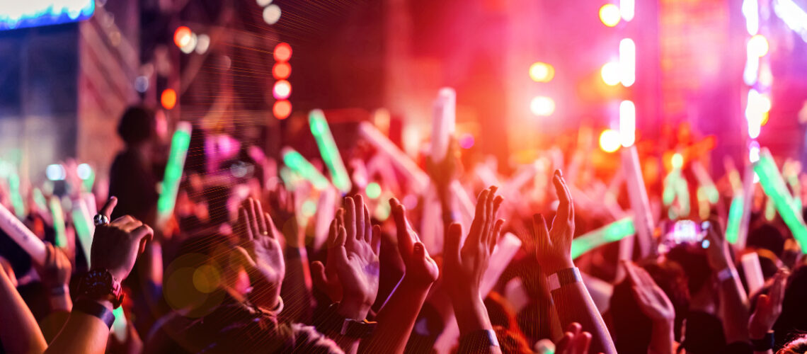 Crowd of people attending a concert.